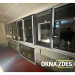 Тёплое остекление длинной лоджии ПВХ (поворотно-откидные, антрацит) — Минск